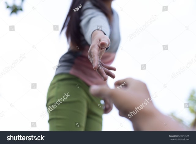 stock-photo-help-concept-hands-reaching-out-to-help-each-other-with-light-flare-521543524.jpg