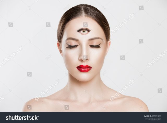 stock-photo-psychic-woman-with-third-eye-looking-at-you-camera-concentrating-thinking-with-mind-and-heart-705934291.jpg