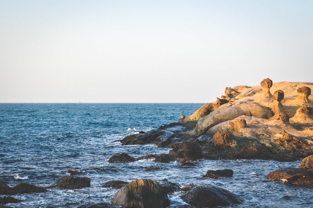 90.Rock formations next to the Pacific Ocean at Yehliu Geopark, Taiwan..jpg