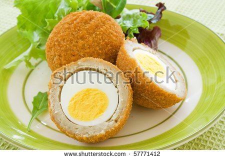 stock-photo-scotch-eggs-on-a-plate-with-a-green-salad-57771412.jpg