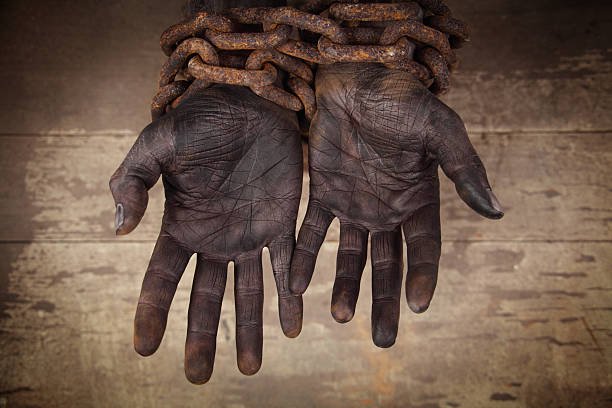 dark-hands-in-heavy-chains-picture-id157503916.jpeg