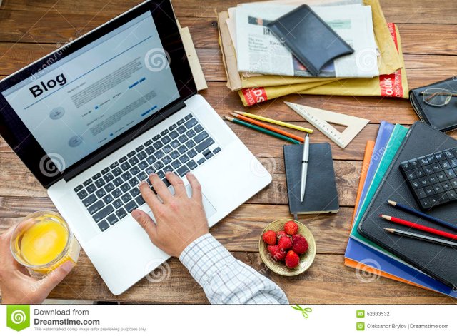 blogger-working-wooden-desk-man-typing-keyboard-drinking-juice-laptop-newspaper-magazines-plate-strawberry-62333532.jpg