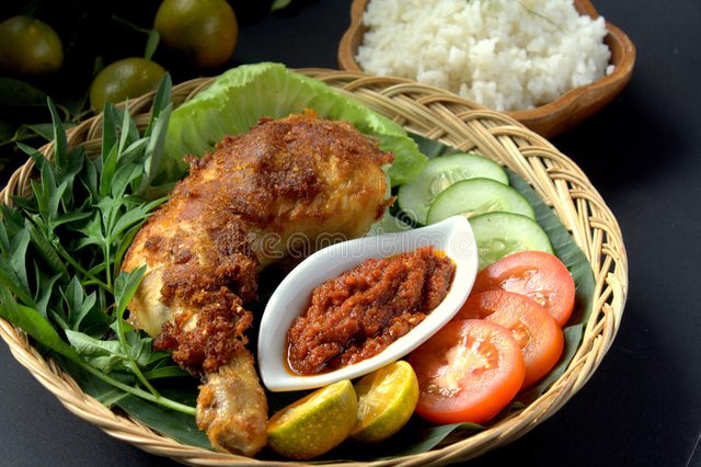 ayam-penyet-set-indonesian-cuisine-fried-chicken-dish-consisting-fried-chicken-served-sambal-slices-66006757.jpg