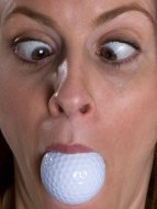 stock-photo-3287003-golf-ball-in-cross-eyed-woman-s-mouth.jpg