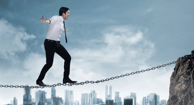 Business-person-balancing-on-the-chain-000090847619_XXXLarge.jpg