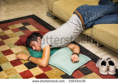 stock-photo-drunk-young-handsome-man-resting-on-couch-in-the-living-room-with-head-on-the-floor-318334130.jpg