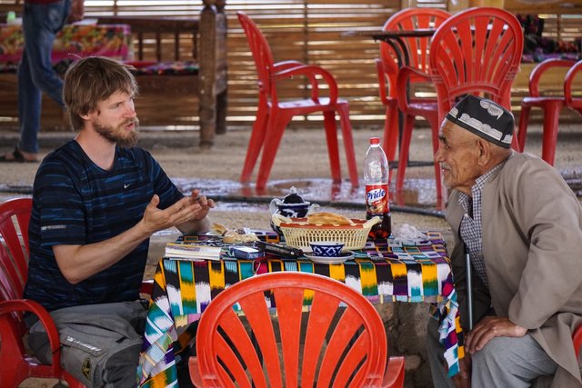 Even with some language barriers you can always find a way to communicate (Martin with a local Uzbek man)_1.jpg