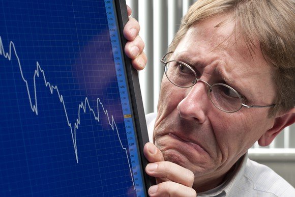 man-worried-about-sinking-stock-market-chart-getty_large.jpg