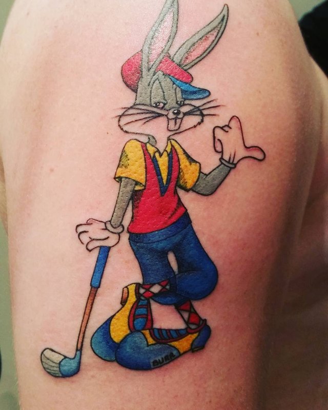 Bugs Bunny tattoo on the thigh