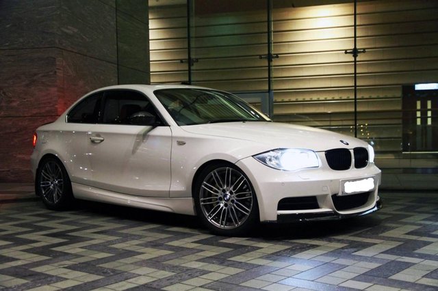 BMW_135i_in_Alpine_White_with_BMW_Performance_upgrades_night_shot.jpg