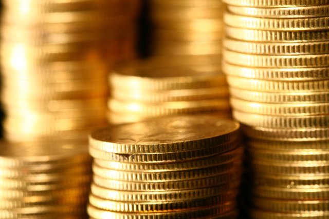 golden piles of coins macro background - Make Money From Cryptocurrencies