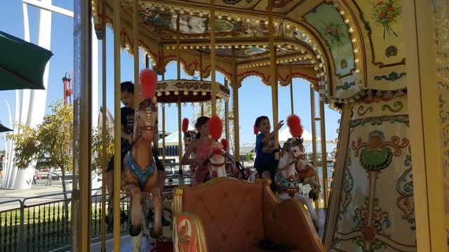 Kids on the carousel at Elizabeth Quay, Perth, Western Australia