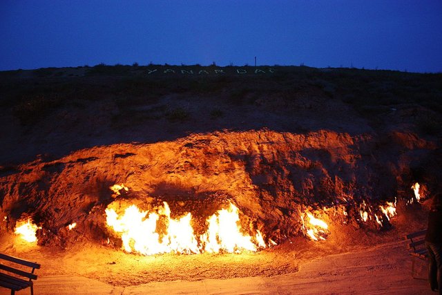 Natural gas miraculously burning at the base of the Yanar Dag mountain