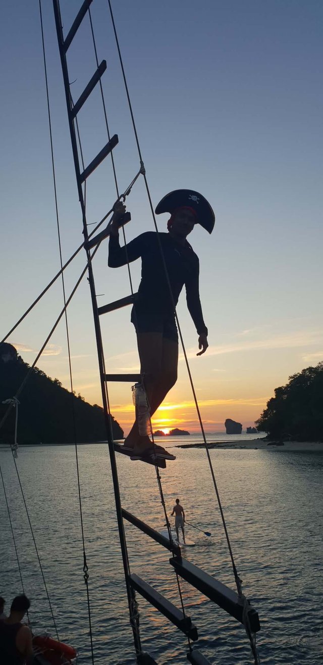 Me posing as a pirate while the sun sets over the Andaman sea