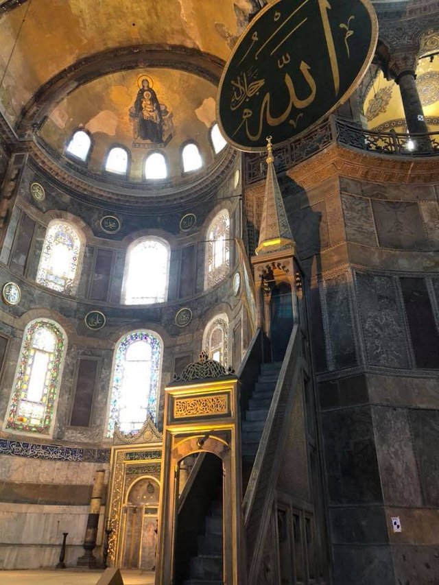 The beautiful co-existence of Christian fresco and Islamic symbols inside the Hagia Sophia