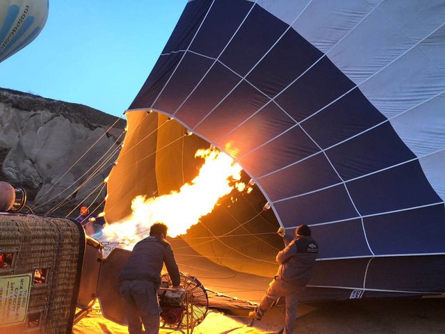 You get to see the crew unload, assemble and inflate the balloon right in front of you
