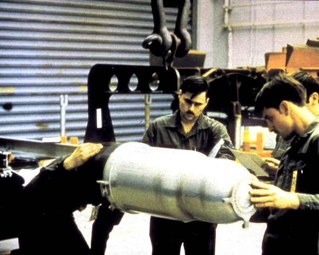 U.S. technicians working with a W80 thermonuclear warhead. Public domain.