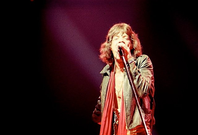 Mick Jagger. In concert with the Rolling Stones in New York City, 1970s. Photo by Dina Regine. Licensed by CC By-SA 2.0.