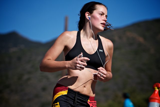 lady jogging in the park with headphones