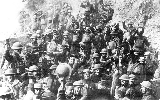 Men of US 64th Regiment, 7th Infantry Division, celebrate the news of the Armistice, November 11, 1918. Public Domain
