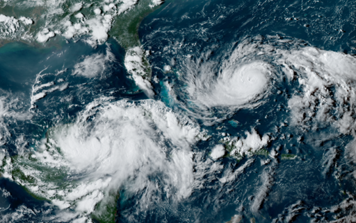  Tropical Storm Idalia (left) and Hurricane Franklin (right) developing in the Atlantic right before the sunset on August 27. Public Domain.