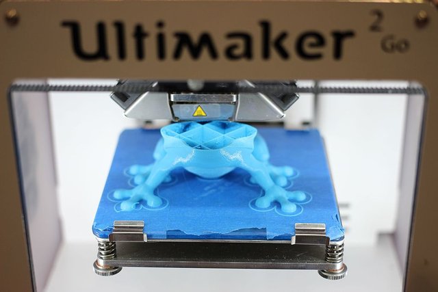 3D printer printing a blue frog