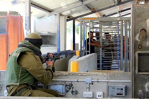 Israeli checkpoint in Palestine's occupied West Bank. Photo by Magne Hagesæter. Creative Commons Attribution-Share Alike 3.0 Unported license.