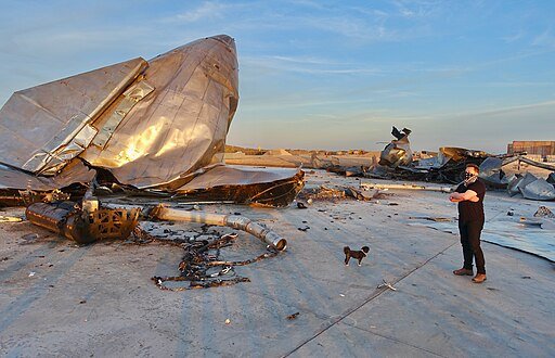 Elon Musk Contemplates the wreckage of Starship SN8. Photo by Steve Jurvetson. Creative Commons Attribution 2.0 Generic license.