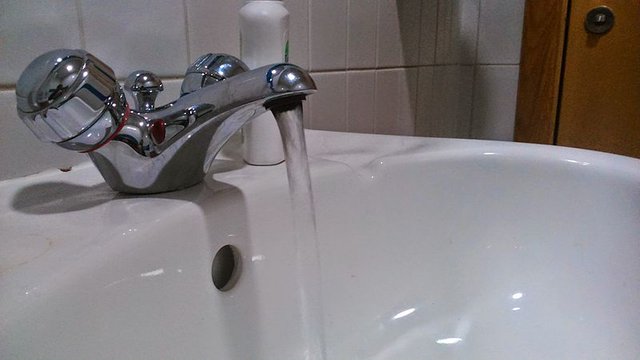 image of a running water tap