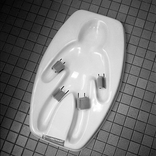 Restraining device used to immobilize infants for circumcision. Photo by James Loewen. Creative Commons Attribution-Share Alike 4.0 International license. 