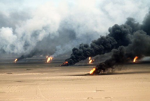 Oil well fires rage outside Kuwait City in the aftermath of Operation Desert Storm. Photo by Tech. Sgt. David McLeod. Public Domain.