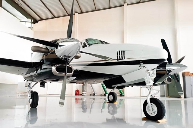 Executive private turboprop plane in a hangar.