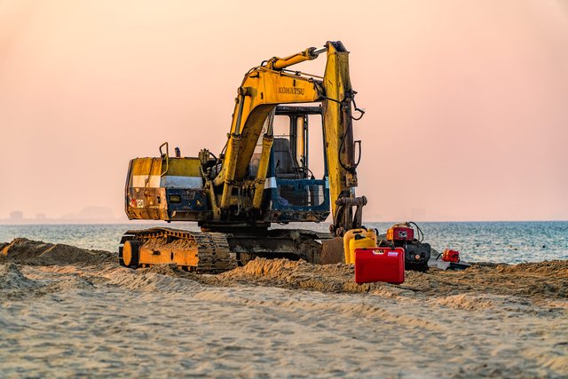 excavator on cua dai beach