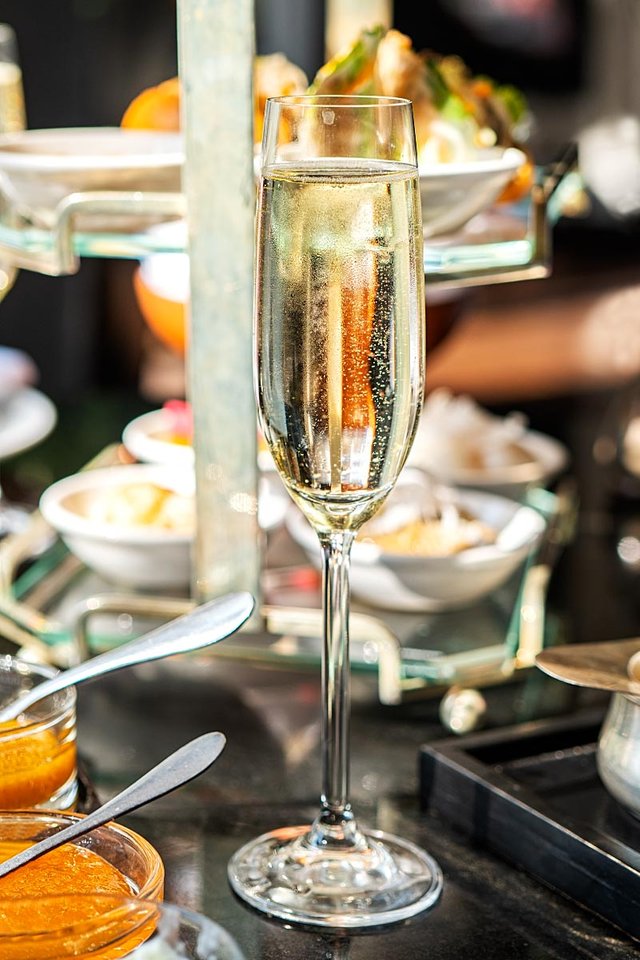 Afternoon tea with a glass of sparkling wine