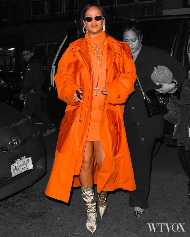 Rihanna wearing streetwear outfit - orange colour