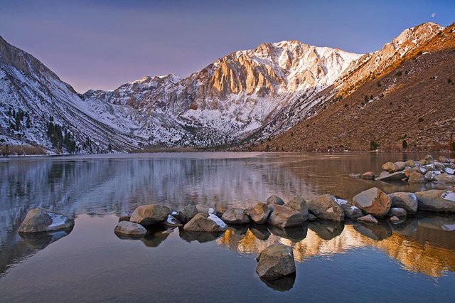 Convict Lake. It's one of a few alpine lakes easily accessible by car in the Eastern Sierras. A slight detour off highway 395. You don't have to hike to get a wonderful view such as this. It's popular for fishing, so if you get here early enough you'll have some cool photographic opportunities.