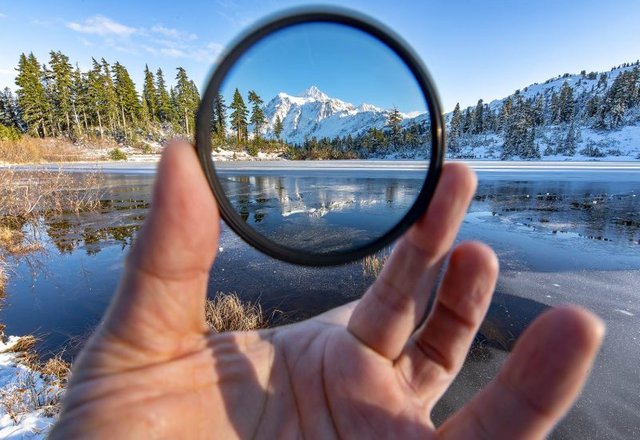 Here's a Circular Polarizer in action. Noticed how much darker and bluer the mountain is compared to the rest of the frame?