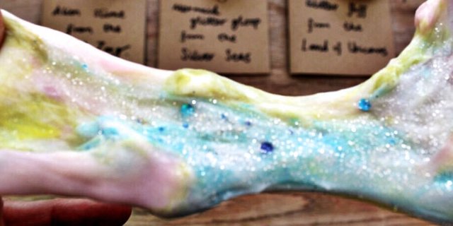 Slime with glitter being stretched