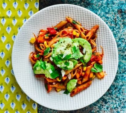 Penne in tomato sauce topped with sliced avocado