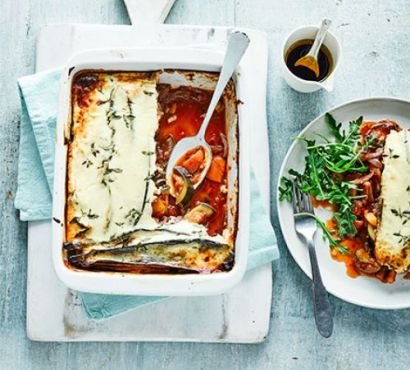 Ratatouille & parmesan bake on an oven dish and plate with rocket side