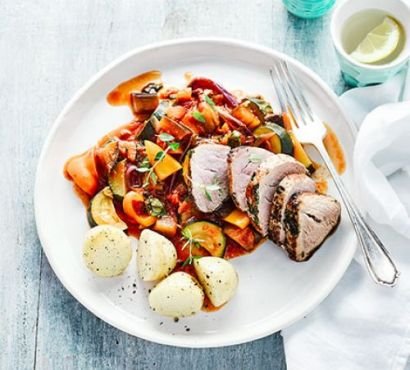 Herb & garlic pork with ratatouille and potatoes on a plate