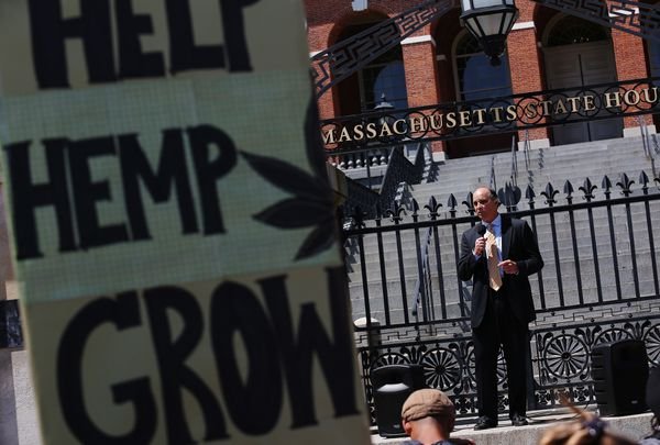 Jim Borghesani, a marijuana consultant and policy advocate, speaks on the steps of the State House.