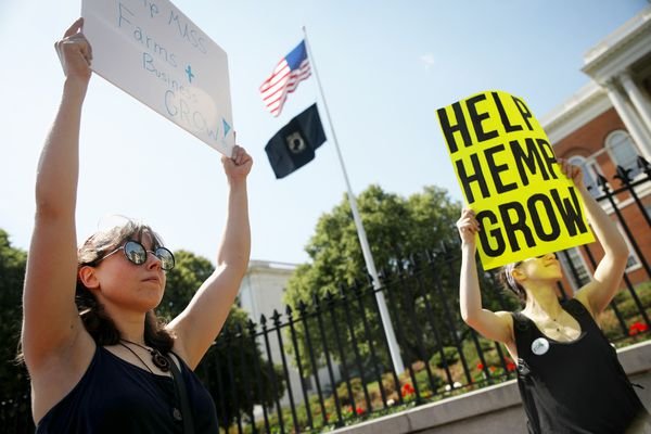 Haley Games, of Haverhill, holds up a sign to support the farming and production of hemp.