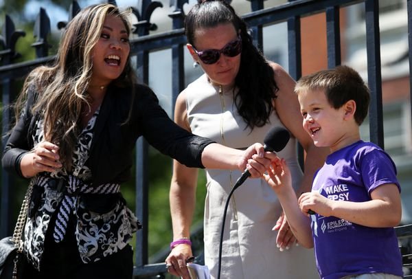 Joshua Faulkner, 6, introduces himself on the steps of the State House. Faulkner has epilepsy and uses CBD oil to control his seizures. Faulkner and his mother, Melissa, center, spoke with at MASS Hemp Coalition press conference Monday.