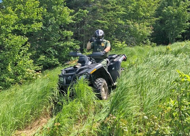 Houlton Border Patrol Sector (Maine) agent patrols the international border on an all-terrain vehicle in Maine. (file photo).