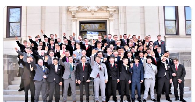 Baraboo male students waving