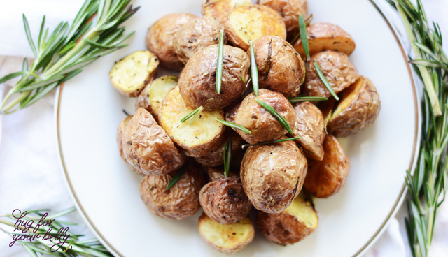 rosemary potatoes on a white plate