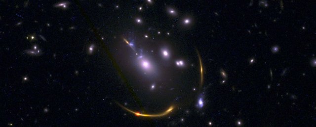 Image from https://www.sciencealert.com/images/2021-10/processed/GalaxyClusterMACSJ0138_1024.jpg