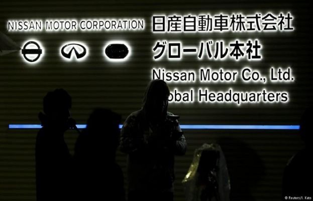 Reporters gather at Nissan's global HQ in Yokohama, Japan on Monday evening ahead of a news conference