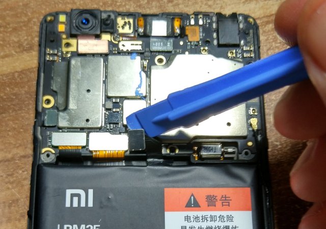 Remove the cable from the motherboard that is next to the battery.